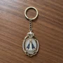 Chaveiro de Nossa Senhora Aparecida Color Oval Dourado Strass