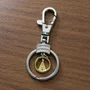 Chaveiro Mosquete de Nossa Senhora Aparecida Redondo Dourado Inox